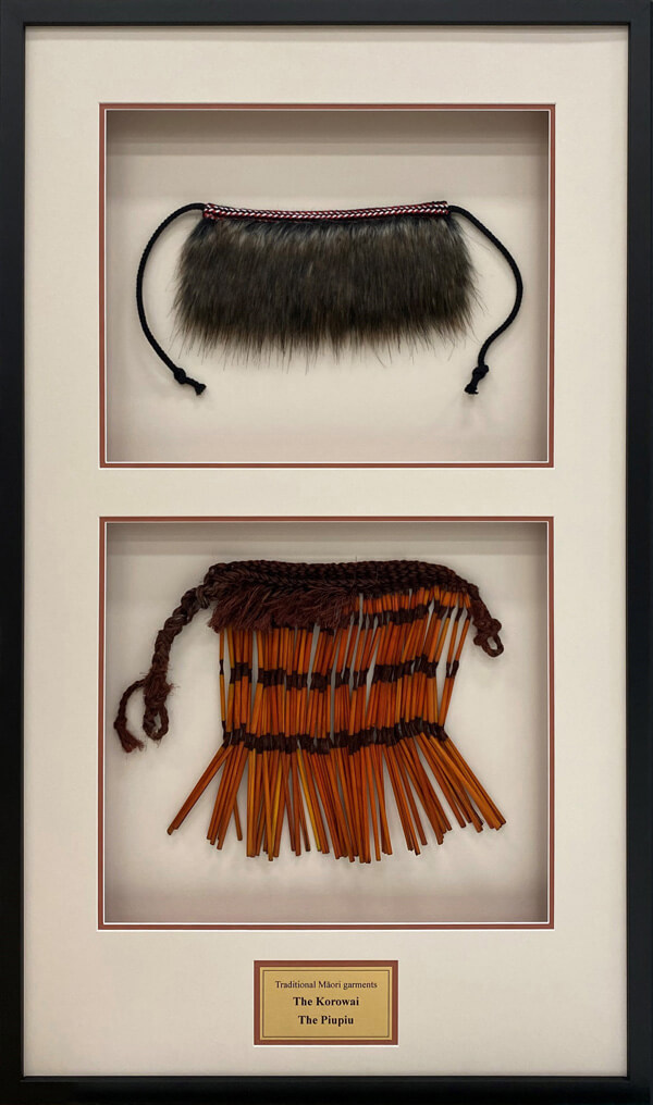 Maori clothing framed with double mats and plaque
